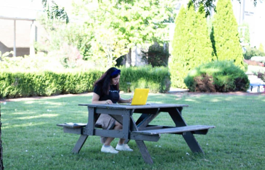 Student studying in the quad.